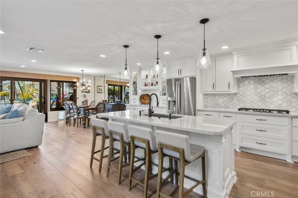 Chandelier, Dining room, Interior, Kitchen, Pendant Lights, Recessed Lighting, Stainless Steel Appliances, Wood Texture Flooring
