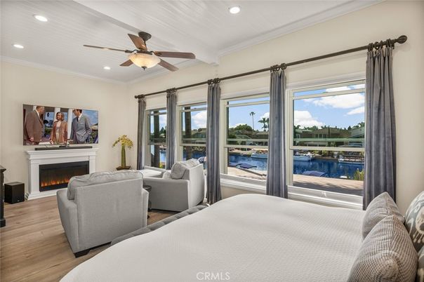Bedroom, Fireplace, Interior, Living room, Recessed Lighting, Water, Wood Texture Flooring