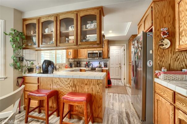 Interior, Kitchen, Recessed Lighting, Tile Countertops, Wood Texture Flooring
