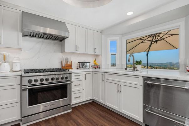 Interior, Kitchen, Marble Walls, Recessed Lighting, Stainless Steel Appliances, Wood Texture Flooring