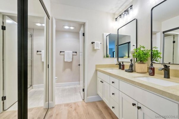 Bathroom, Dual Sink Vanities, Glass Shower, Interior, Wood Texture Flooring