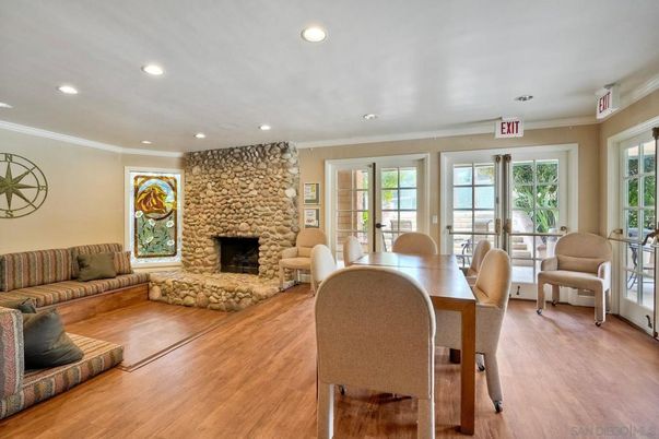 Dining room, Fireplace, Interior, Living room, Recessed Lighting, Stone Walls, Wood Texture Flooring