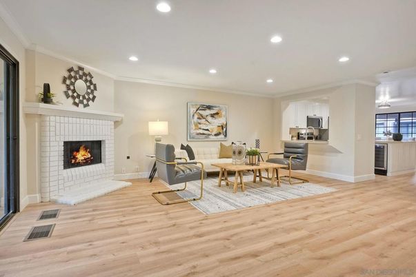 Dining room, Fireplace, Interior, Living room, Recessed Lighting, Wood Texture Flooring
