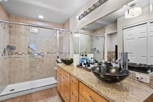 Bathroom, Dual Sink Vanities, Glass Shower, Interior, Recessed Lighting, Wood Texture Flooring