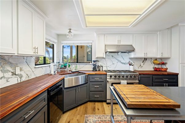 Interior, Kitchen, Marble Walls, Stainless Steel Appliances, Wood Texture Flooring