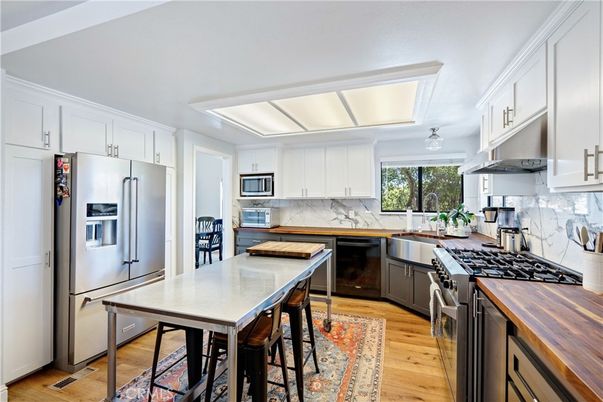 Interior, Kitchen, Marble Walls, Stainless Steel Appliances, Wood Texture Flooring