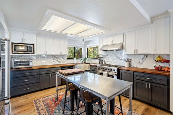 Interior, Kitchen, Marble Walls, Stainless Steel Appliances, Wood Texture Flooring