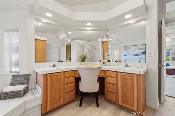Bathroom, Dual Sink Vanities, Interior, Recessed Lighting, Tile Countertops, Wood Texture Flooring