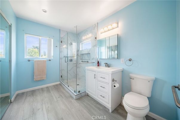 Bathroom, Glass Shower, Interior, Marble Walls, Recessed Lighting, Wood Texture Flooring