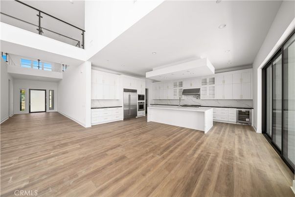 Interior, Kitchen, Marble Walls, Recessed Lighting, Stainless Steel Appliances, Wood Texture Flooring