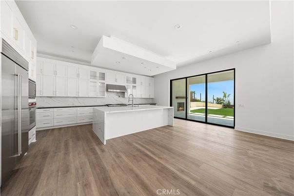 Interior, Kitchen, Marble Walls, Recessed Lighting, Stainless Steel Appliances, Wood Texture Flooring