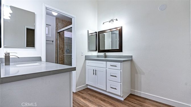 Bathroom, Dual Sink Vanities, Glass Shower, Interior, Wood Texture Flooring