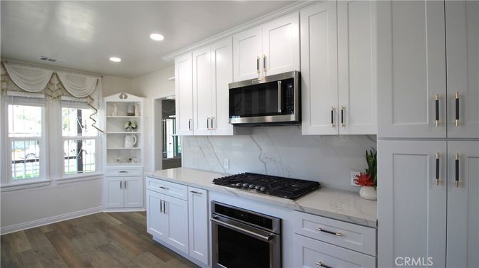 Interior, Kitchen, Marble Walls, Recessed Lighting, Stainless Steel Appliances, Wood Texture Flooring