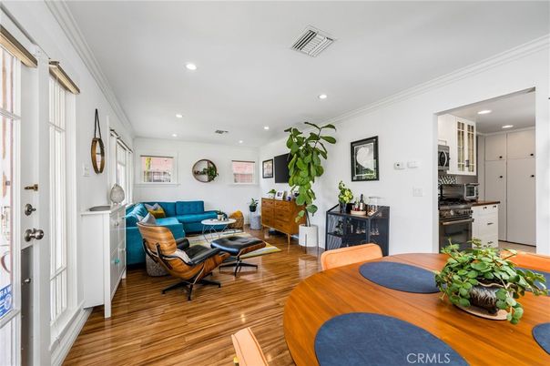 Dining room, Interior, Kitchen, Living room, Recessed Lighting, Stainless Steel Appliances, Wood Texture Flooring