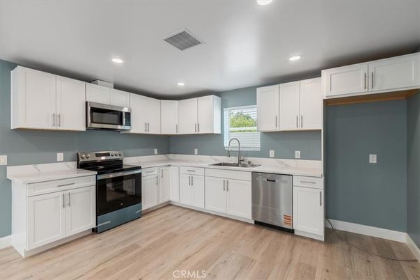 Interior, Kitchen, Recessed Lighting, Stainless Steel Appliances, Wood Texture Flooring