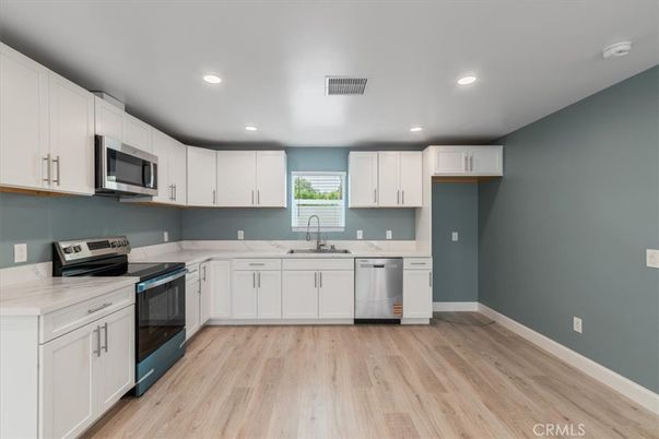 Interior, Kitchen, Recessed Lighting, Stainless Steel Appliances, Wood Texture Flooring