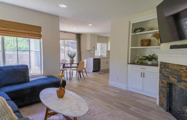 Dining room, Fireplace, Interior, Living room, Recessed Lighting, Wood Texture Flooring