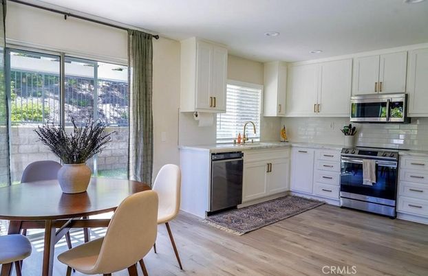 Dining room, Interior, Kitchen, Recessed Lighting, Stainless Steel Appliances, Wood Texture Flooring