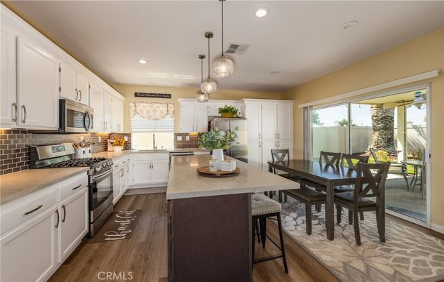 Dining room, Interior, Kitchen, Pendant Lights, Recessed Lighting, Stainless Steel Appliances, Wood Texture Flooring