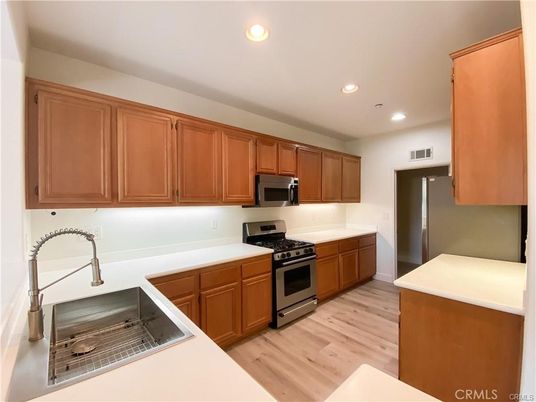 Interior, Kitchen, Recessed Lighting, Stainless Steel Appliances, Wood Texture Flooring