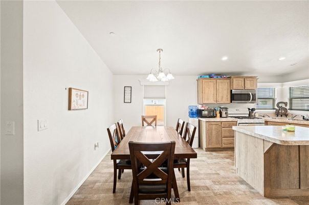 Chandelier, Dining room, Interior, Kitchen, Recessed Lighting, Stainless Steel Appliances, Wood Texture Flooring