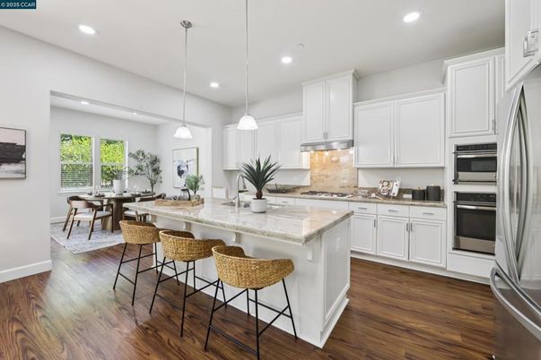 Dining room, Interior, Kitchen, Pendant Lights, Recessed Lighting, Stainless Steel Appliances, Wood Texture Flooring