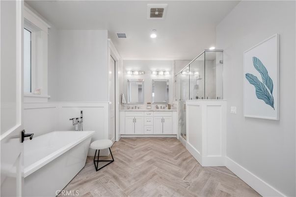 Bathroom, Dual Sink Vanities, Free Standing Baths, Glass Shower, Interior, Recessed Lighting, Wood Texture Flooring