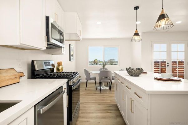 Dining room, Interior, Kitchen, Pendant Lights, Recessed Lighting, Stainless Steel Appliances, Wood Texture Flooring
