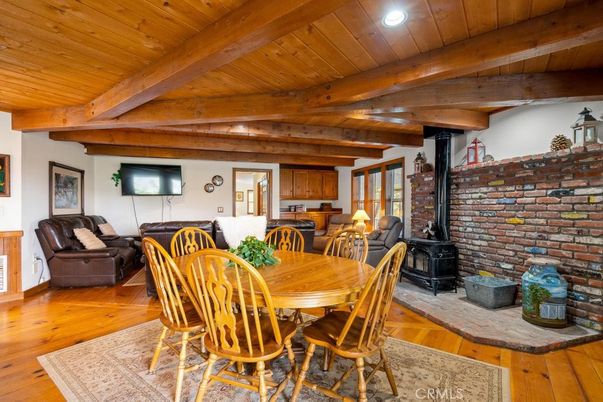 Dining room, Fireplace, Interior, Recessed Lighting, Stone Walls, Wooden Beams, Wooden Ceilings, Wood Texture Flooring