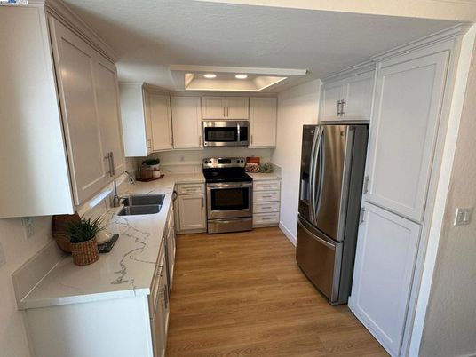 Interior, Kitchen, Recessed Lighting, Stainless Steel Appliances, Wood Texture Flooring