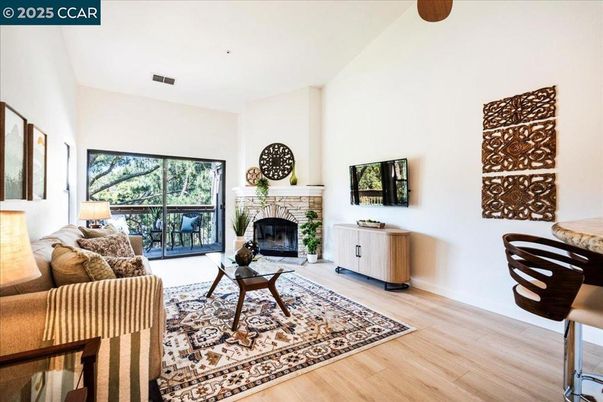 Fireplace, Interior, Kitchen, Living room, Recessed Lighting, Stainless Steel Appliances, Wood Texture Flooring
