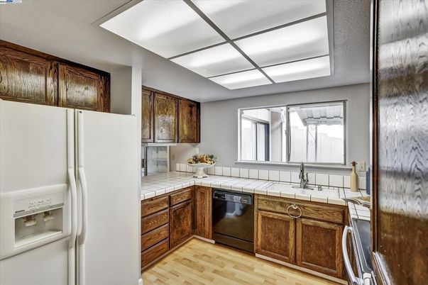 Interior, Kitchen, Tile Countertops, Wood Texture Flooring