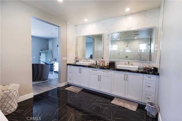 Bathroom, Dual Sink Vanities, Glass Shower, Interior, Marble, Marble Walls, Recessed Lighting