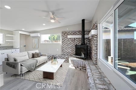 Fireplace, Interior, Living room, Recessed Lighting, Stone Walls, Wood Texture Flooring