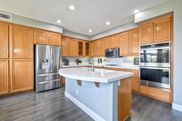 Interior, Kitchen, Recessed Lighting, Stainless Steel Appliances, Tile Countertops, Wood Texture Flooring