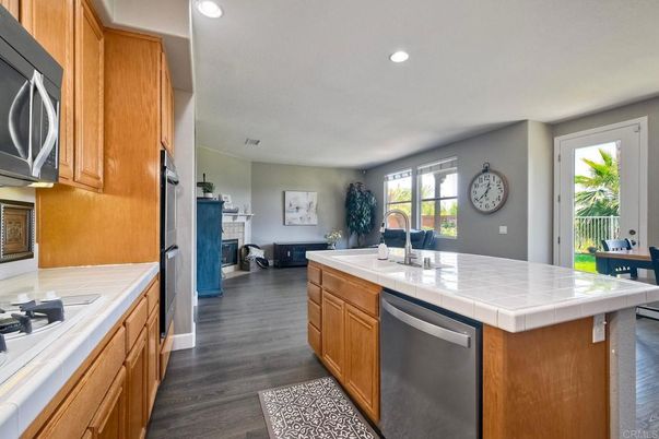 Fireplace, Interior, Kitchen, Recessed Lighting, Tile Countertops, Wood Texture Flooring