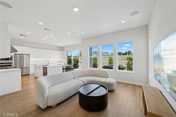 Dining room, Interior, Kitchen, Living room, Recessed Lighting, Stainless Steel Appliances, Wood Texture Flooring