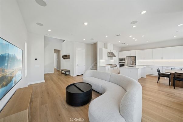 Dining room, Interior, Kitchen, Living room, Recessed Lighting, Stainless Steel Appliances, Wood Texture Flooring
