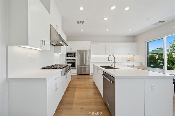 Interior, Kitchen, Recessed Lighting, Stainless Steel Appliances, Wood Texture Flooring
