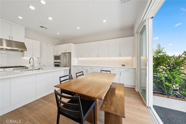 Dining room, Interior, Kitchen, Recessed Lighting, Stainless Steel Appliances, Wood Texture Flooring