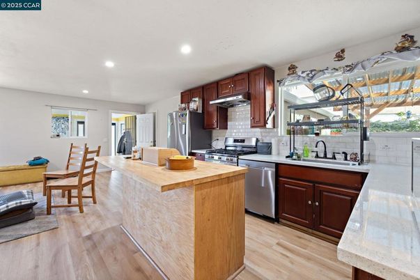 Dining room, Interior, Kitchen, Recessed Lighting, Stainless Steel Appliances, Wood Texture Flooring