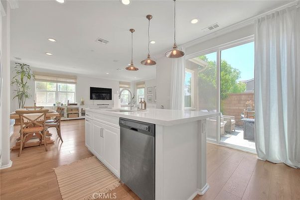 Dining room, Interior, Kitchen, Pendant Lights, Recessed Lighting, Stainless Steel Appliances, Wood Texture Flooring