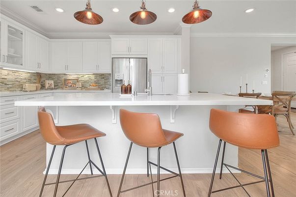 Dining room, Interior, Kitchen, Pendant Lights, Recessed Lighting, Stainless Steel Appliances, Wood Texture Flooring