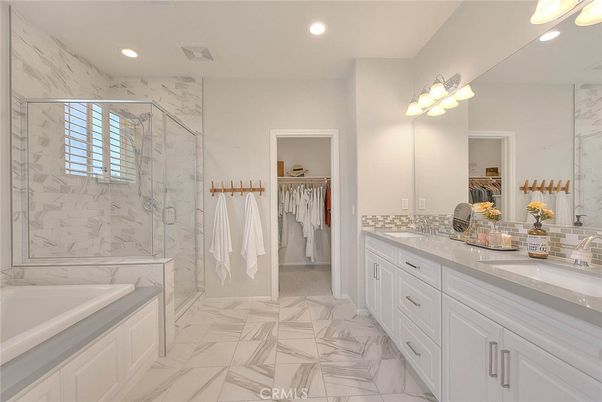 Bathroom, Dual Sink Vanities, Glass Shower, Interior, Marble, Marble Walls, Recessed Lighting, Walk-in Closets