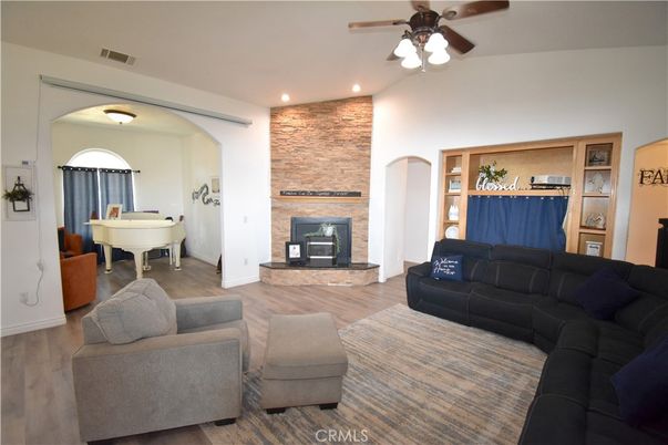 Fireplace, Interior, Living room, Recessed Lighting, Stone Walls, Wood Texture Flooring