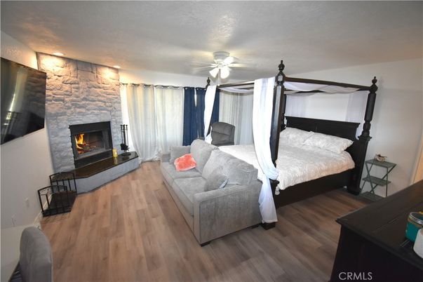 Bedroom, Fireplace, Interior, Stone Walls, Wood Texture Flooring