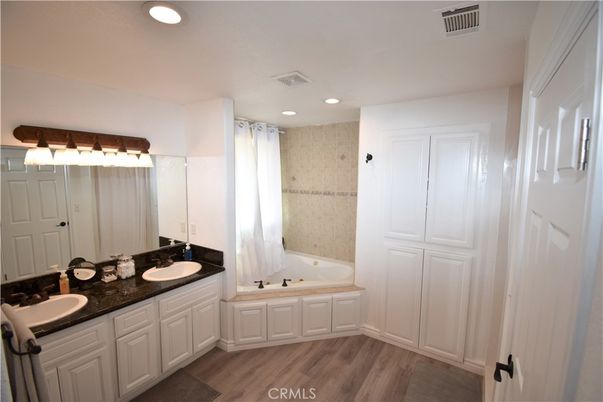 Bathroom, Dual Sink Vanities, Interior, Recessed Lighting, Wood Texture Flooring