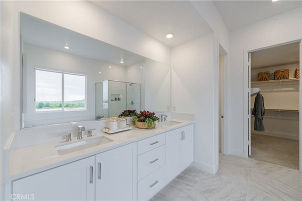 Bathroom, Dual Sink Vanities, Glass Shower, Interior, Marble, Recessed Lighting, Walk-in Closets