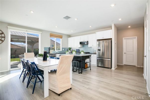 Dining room, Interior, Kitchen, Recessed Lighting, Stainless Steel Appliances, Wood Texture Flooring