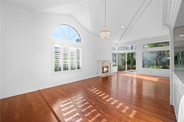 Chandelier, Empty room, Fireplace, Interior, Pendant Lights, Recessed Lighting, Wood Texture Flooring